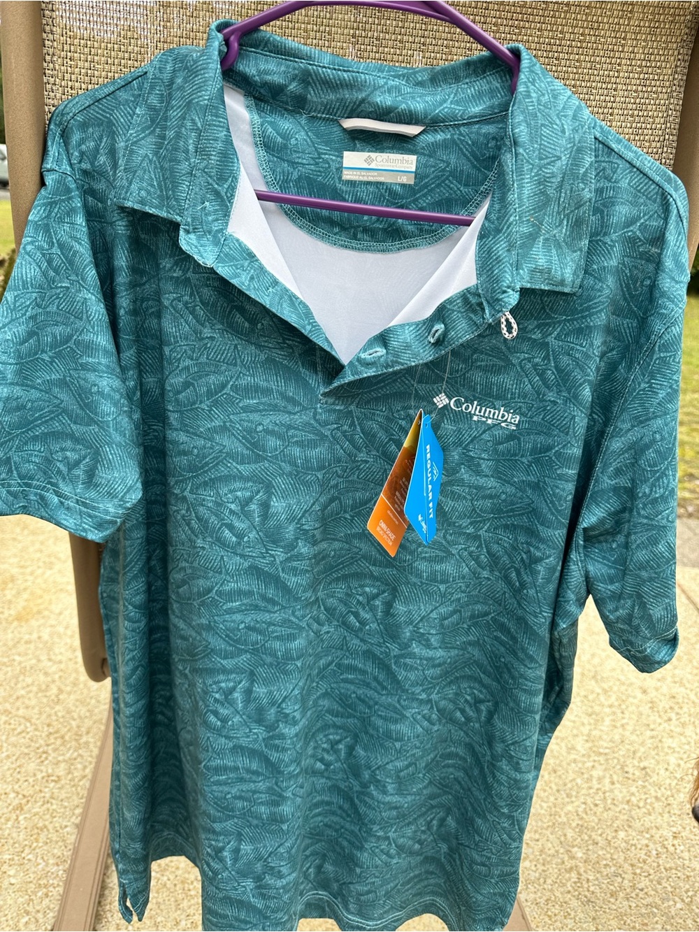 Columbia Men's Teal Performance Polo with fish accents